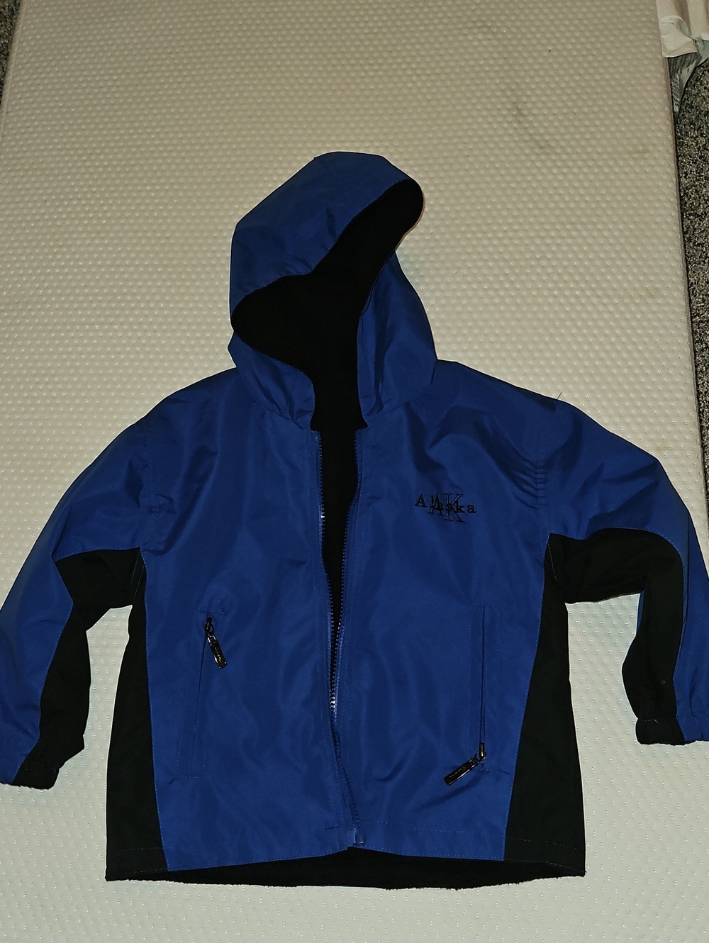 ALOHAS Kids Royal Blue and Black Hooded Rain Jacket. Riversable
